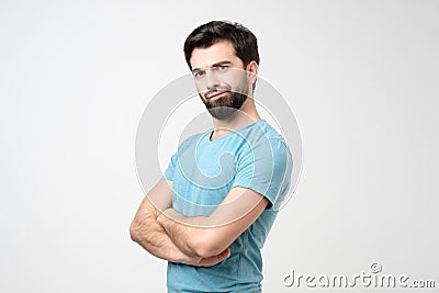 Young hispanic man frowning face in displeasure Stock Photo