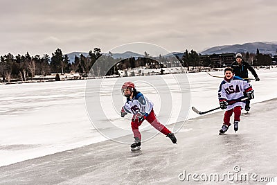 Young Hockey Skiers Skating on Mirror Lake Editorial Stock Photo