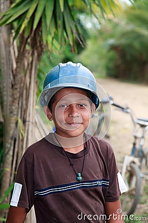 Young Honduran Boy Wearing a Construction Hard Hat Editorial Stock Photo