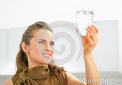 Young housewife looking on glass of water Stock Photo