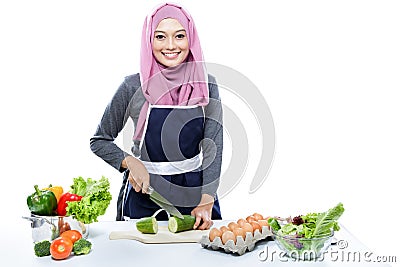 Young housewife preparing making food for dinner Stock Photo