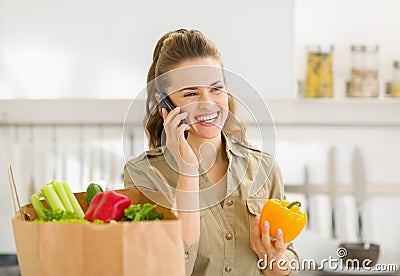 Young housewife sort purchases after shopping Stock Photo