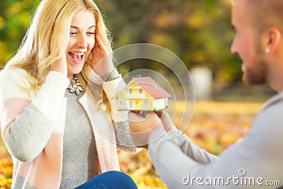 Young Husband surprises with new family house. Stock Photo