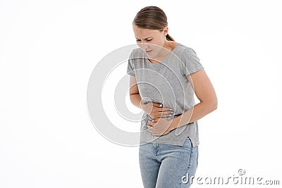 Young sick woman is feeling unwell, ache, pain, bad. White background. Stock Photo