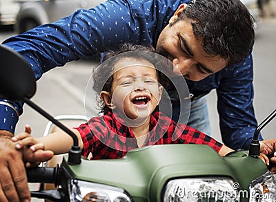 Young Indian boy riding the motorbike Stock Photo