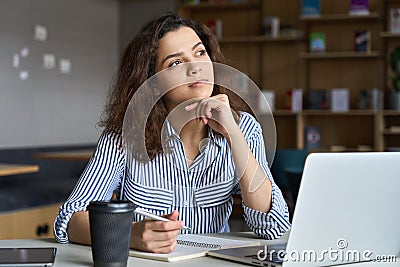 Young latin indian student using laptop learning online in virtual class. Stock Photo