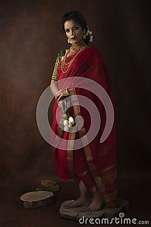 Young Indian female wearing Maharashtrian style red saree Stock Photo