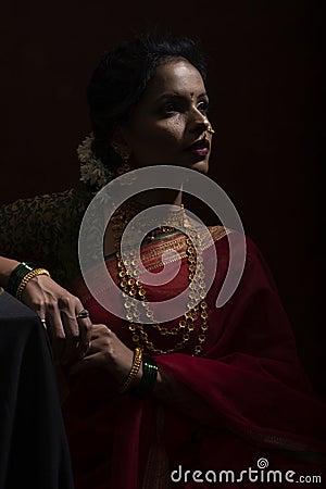 Young Indian female wearing Maharashtrian style red saree Stock Photo