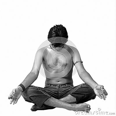 A young Indian modern man meditatin in lotus pose Editorial Stock Photo