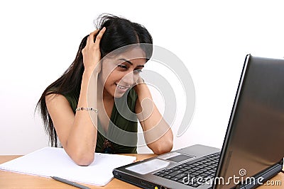 Young Indian student working on a Laptop. Stock Photo