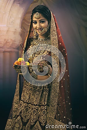 Young Indian woman in bridal wear Stock Photo