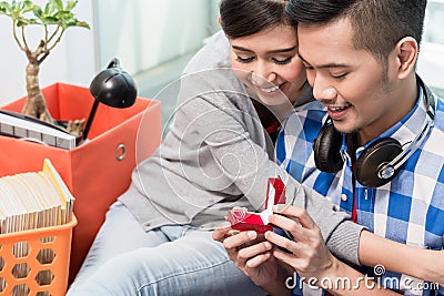 Young Indonesian man makes proposal to girlfriend Stock Photo