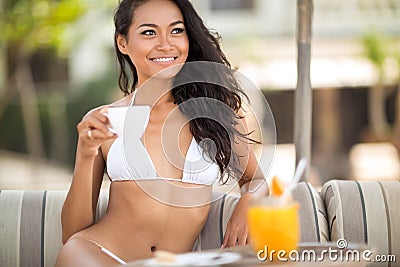 Young Indonesian woman in tropical resort Stock Photo