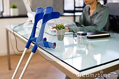 Young Injured Employee At Workplace Stock Photo