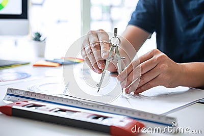 Young Interior graphic designer working project sketching on graphic tablet working at modern office, creative inspiration and Stock Photo