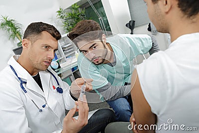 Young internist student learning with experienced doctor Stock Photo
