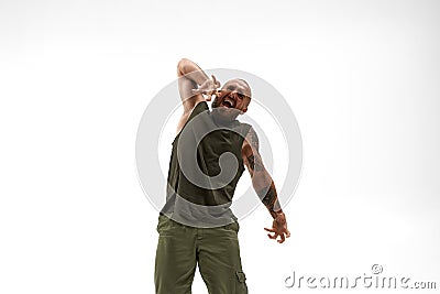 Young irritated bald man gesticulate and scream Stock Photo