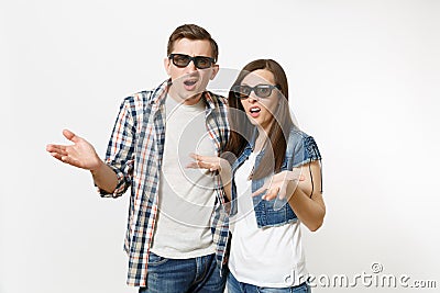 Young irritated dissatisfied couple, woman and man in 3d glasses and casual clothes watching movie film on date and Stock Photo