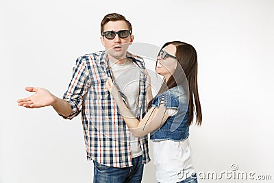 Young irritated dissatisfied couple, woman and man in 3d glasses and casual clothes watching movie film on date Stock Photo