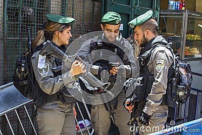 Young Israeli Security police behind crowd control barriers close to the Damascus Gate Editorial Stock Photo