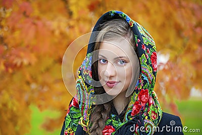 Young Italians in coat and knit a scarf on her head Stock Photo