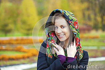 Young Italians in coat and knit a scarf on her head Stock Photo