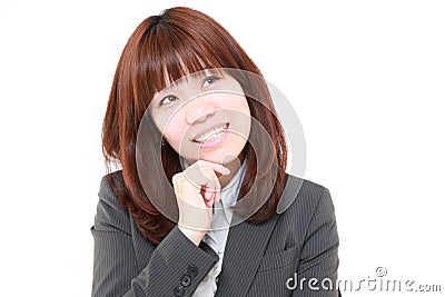 Young Japanese businesswoman thinks Stock Photo