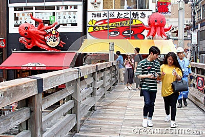 Young Japanese couples wooden bridge, Dotonbori, Osaka Editorial Stock Photo