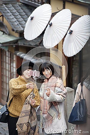 Young Japanese girls taking a selfie Editorial Stock Photo