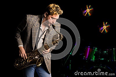 Young jazz musician with saxophone Stock Photo