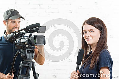A young journalist and a cameraman Stock Photo