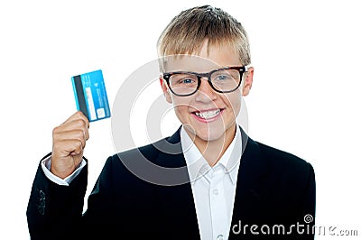 Young kid in business suit flaunting a debit card Stock Photo