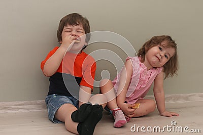 Young kid playing on a floor in a room Stock Photo