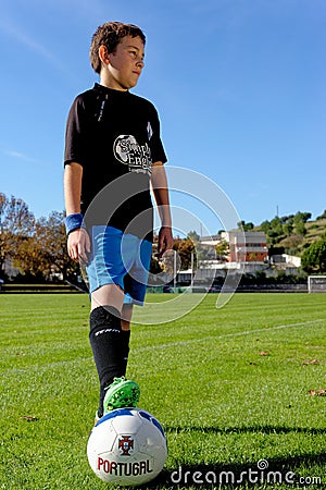 Young kid wearing Football or Soccer kit Editorial Stock Photo