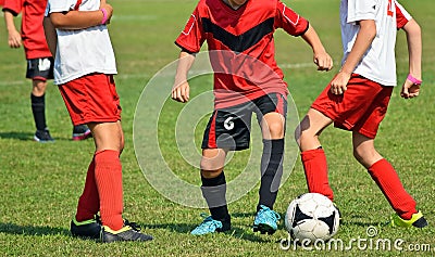 Young kids in action at the soccer match Stock Photo