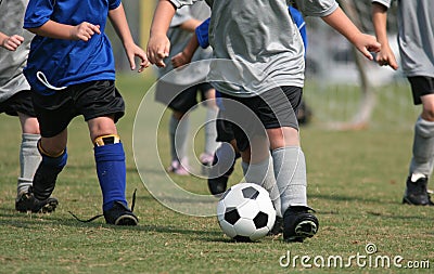 Young Kids Playing Soccer Stock Photo