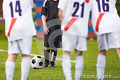 Young kids playing soccer football game. Free kick training Stock Photo