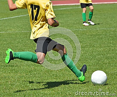 Young kids playing soccer Stock Photo