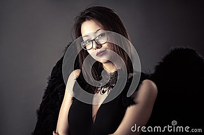 Young Korean girl with black wings Stock Photo