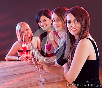 Young ladies at a bar counter Stock Photo