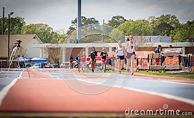 Ladies Compete in 1600 Meter Race at Invitational Editorial Stock Photo