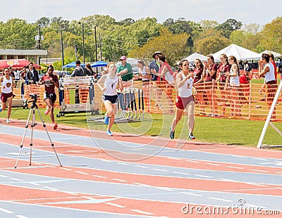 Ladies Compete in 1600 Meter Race at Invitational Editorial Stock Photo