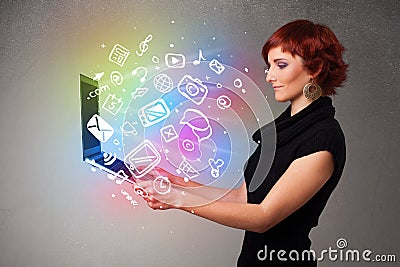 Young lady holding notebook with colorful hand drawn multimedia Stock Photo