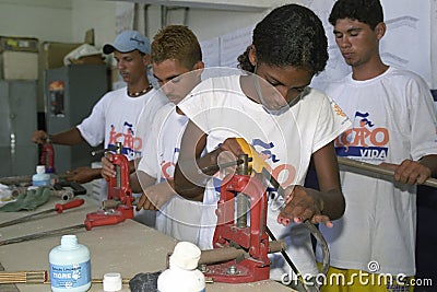 Young lady learns the craft fitter at technical school Editorial Stock Photo