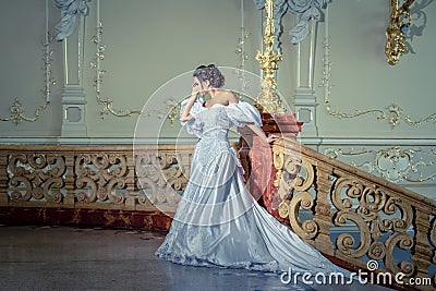 A young lady in a luxurious white dress Stock Photo