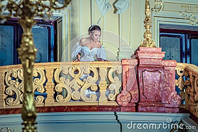 A young lady in a luxurious white dress Stock Photo