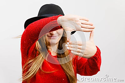 Young lady making camera gesture. Stock Photo