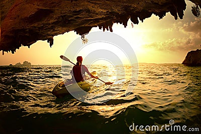 Young lady paddling the kayak Stock Photo