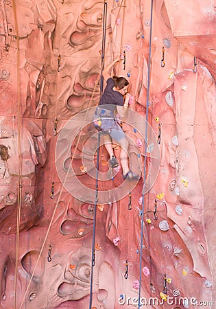 Young lady rock climbing Editorial Stock Photo