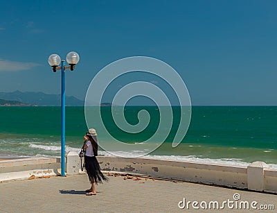 Young Lady Tourist Taking Vacation Photographs Stock Photo